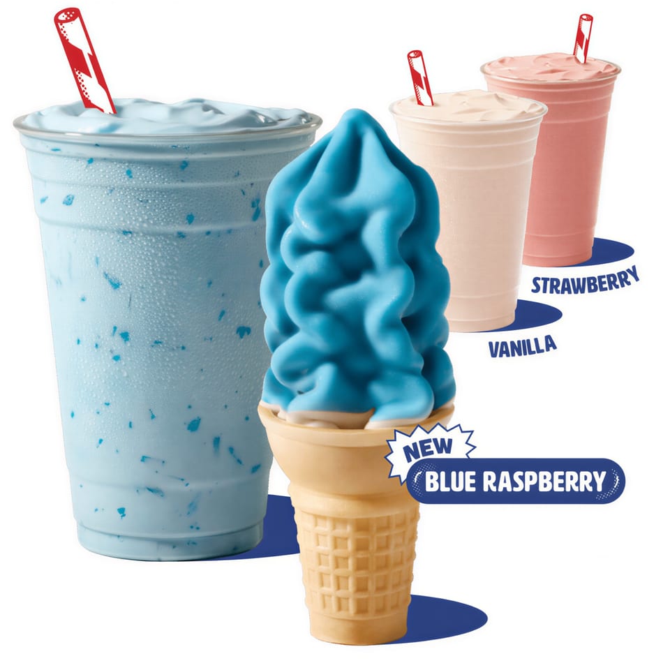 Blue raspberry milkshake and ice cream cone, with vanilla and strawberry milkshakes in the background.
